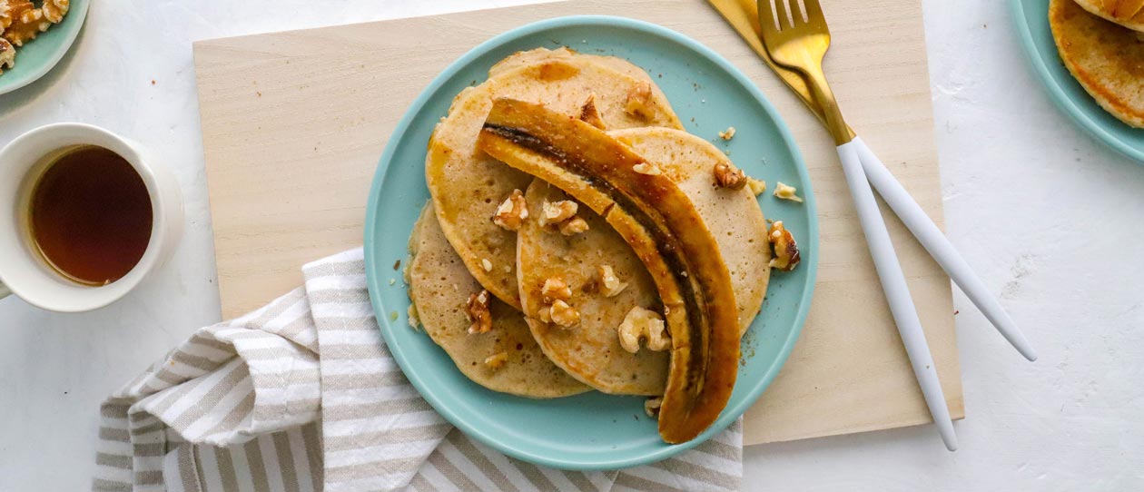 Caramelised banana buckwheat pancakes with walnuts and maple syrup