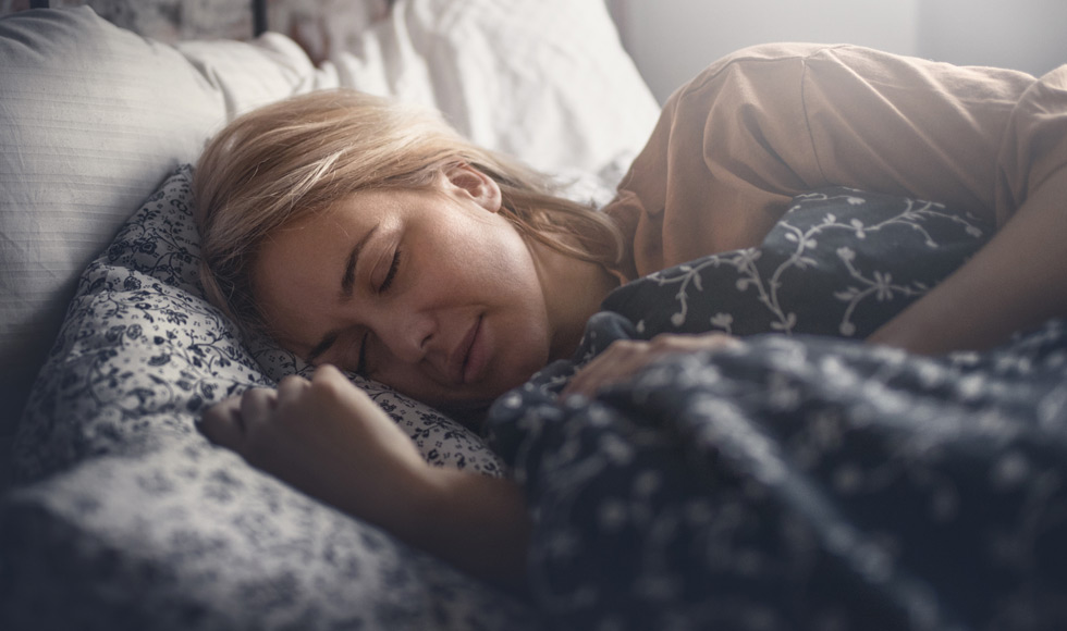 Woman asleep, lying on her side