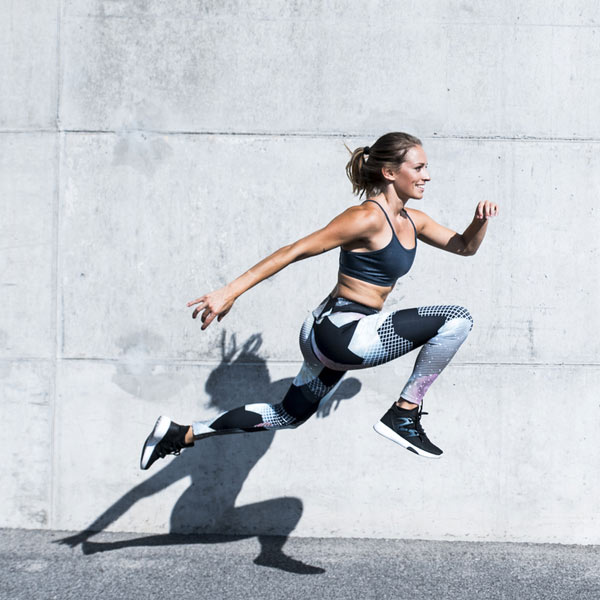 A young woman working out doing high intensity training