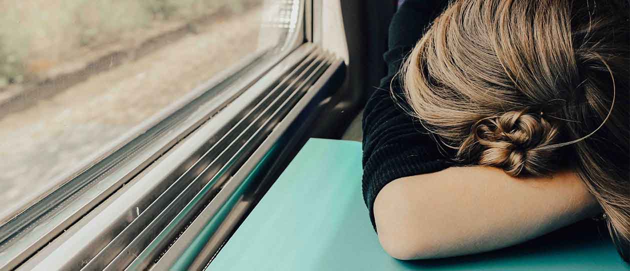 Shift worker asleep on train